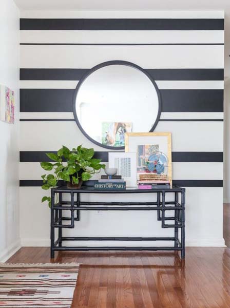 Foyer with black and white stripped wallpaper